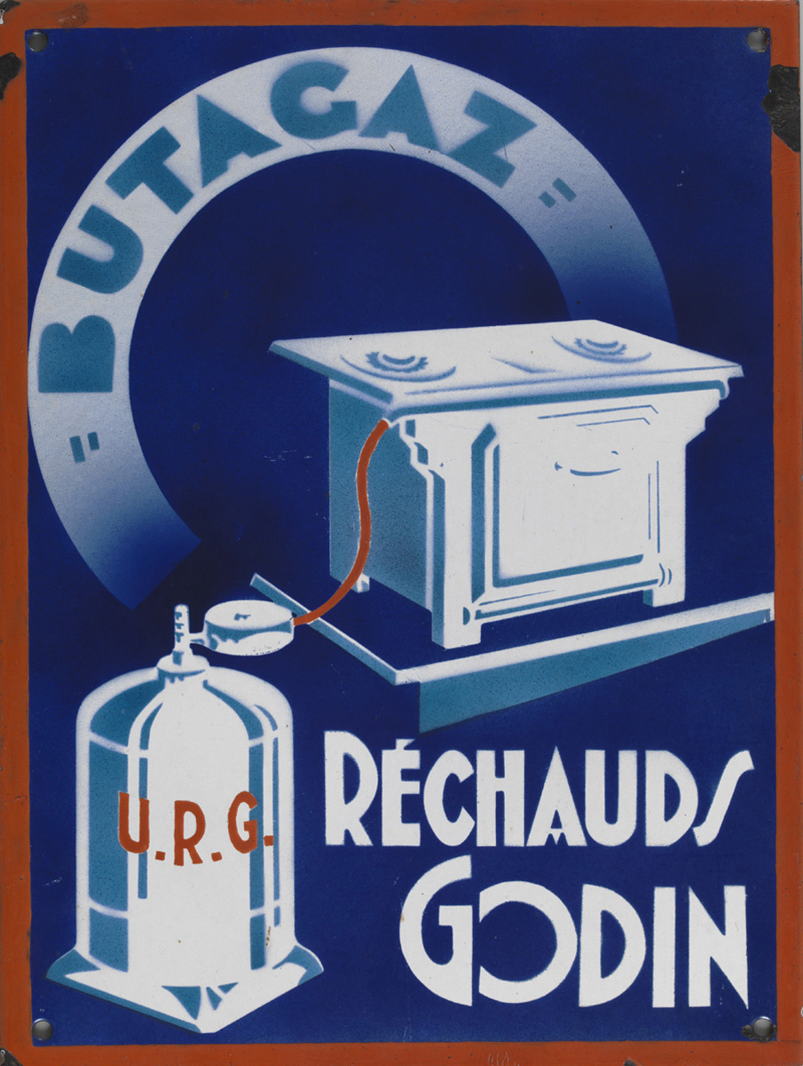 La plaque publicitaire montre, sur un fond bleu, un réchaud "Godin" alimenté par